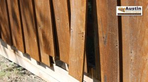 broken planks on fence