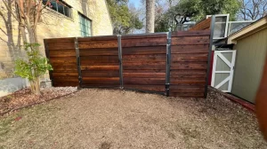 Stained privacy wood fence with a rich finish