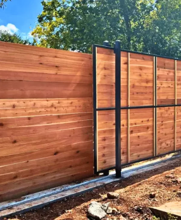 Residential wooden privacy fence with gate for secure access